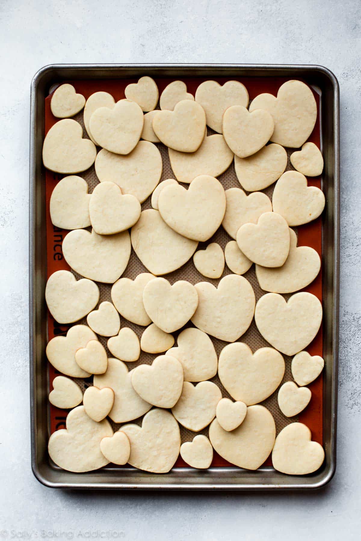 heart sugar cookies without icing on a baking sheet