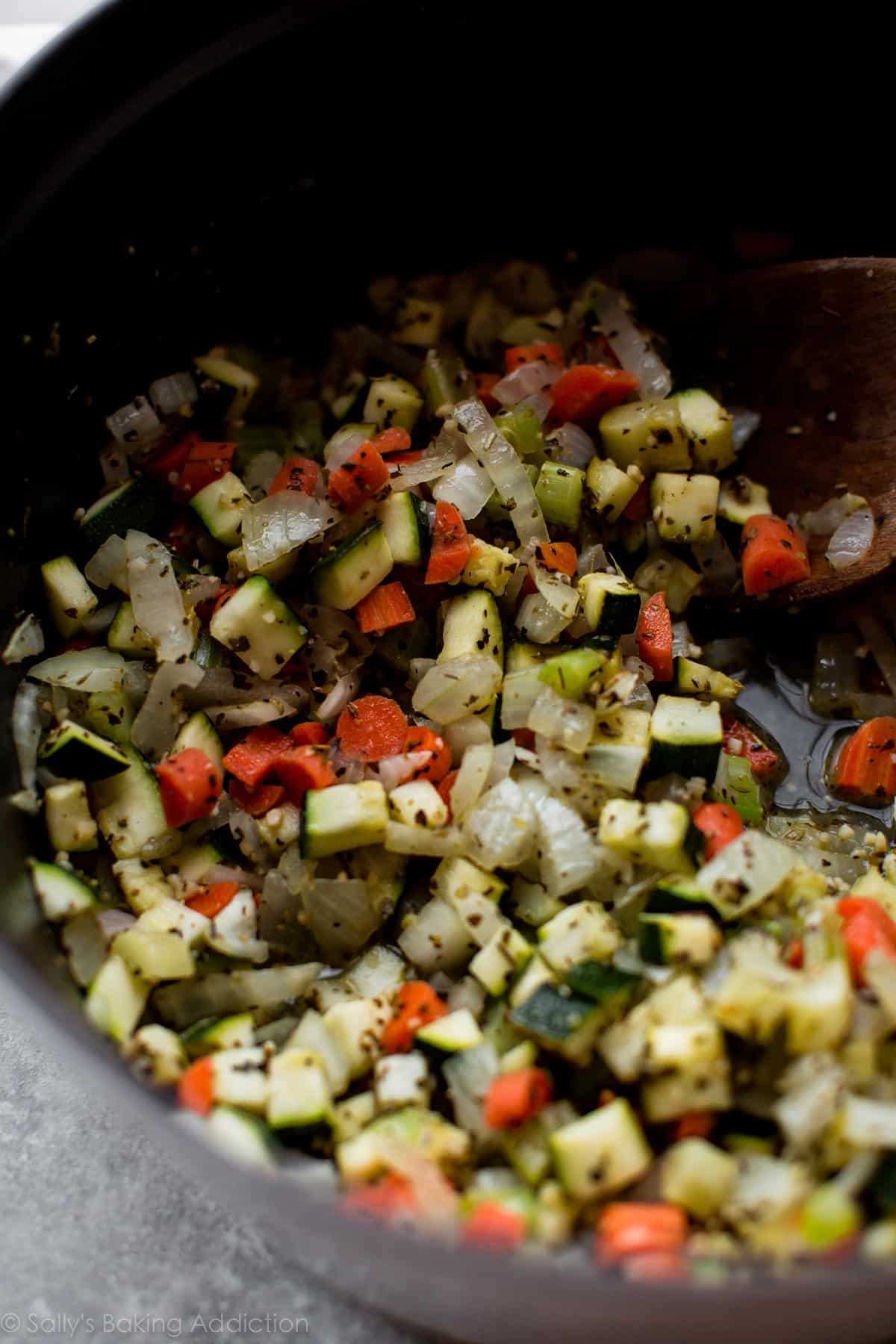 chopped sautéed vegetables in a pot.