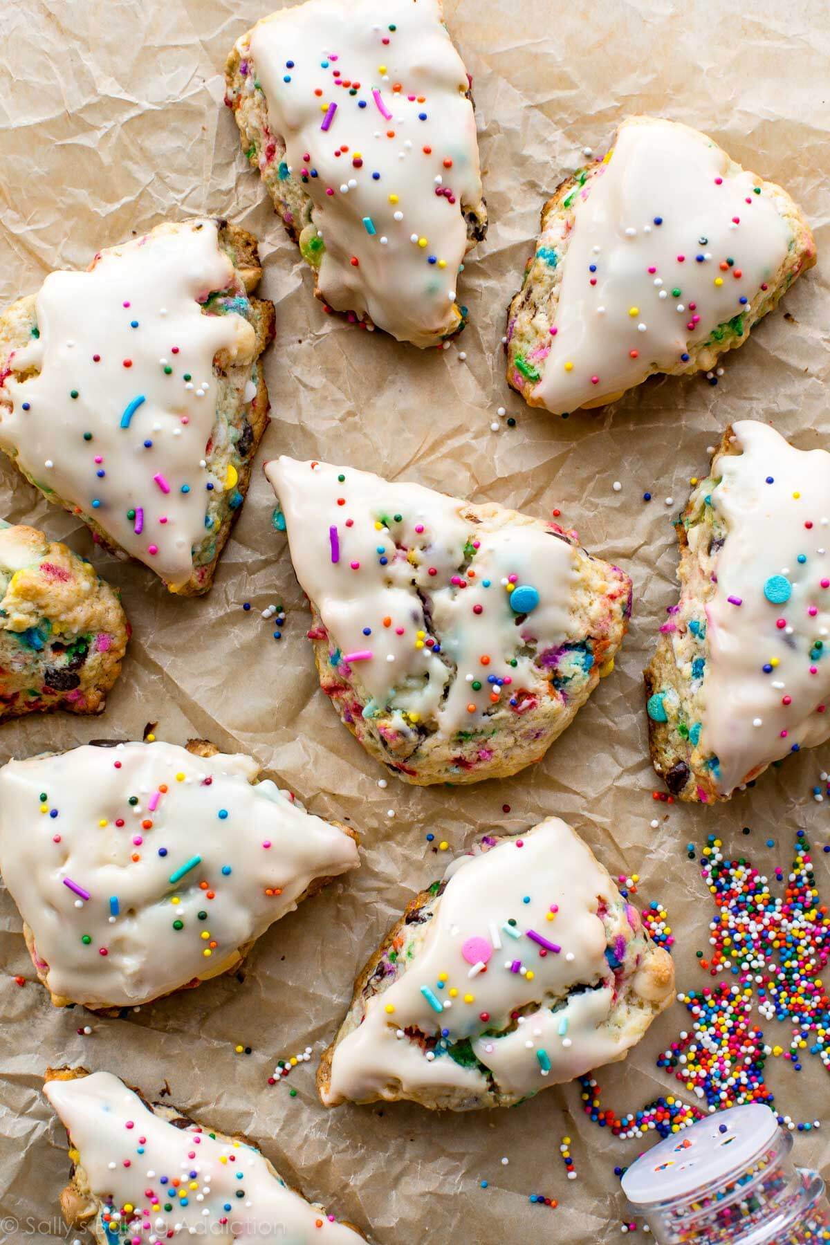 overhead image of sprinkle scones with vanilla icing and sprinkles