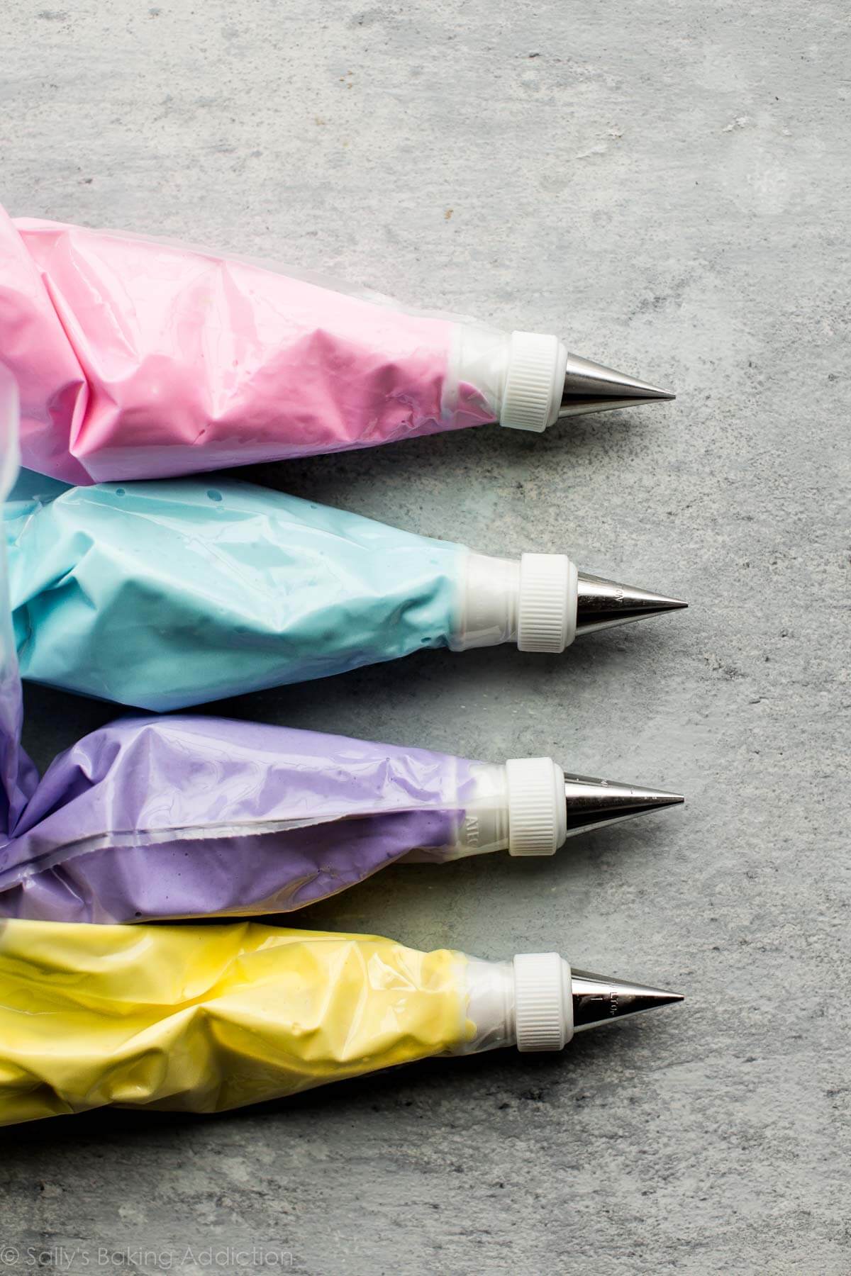 piping bags of pastel royal icing
