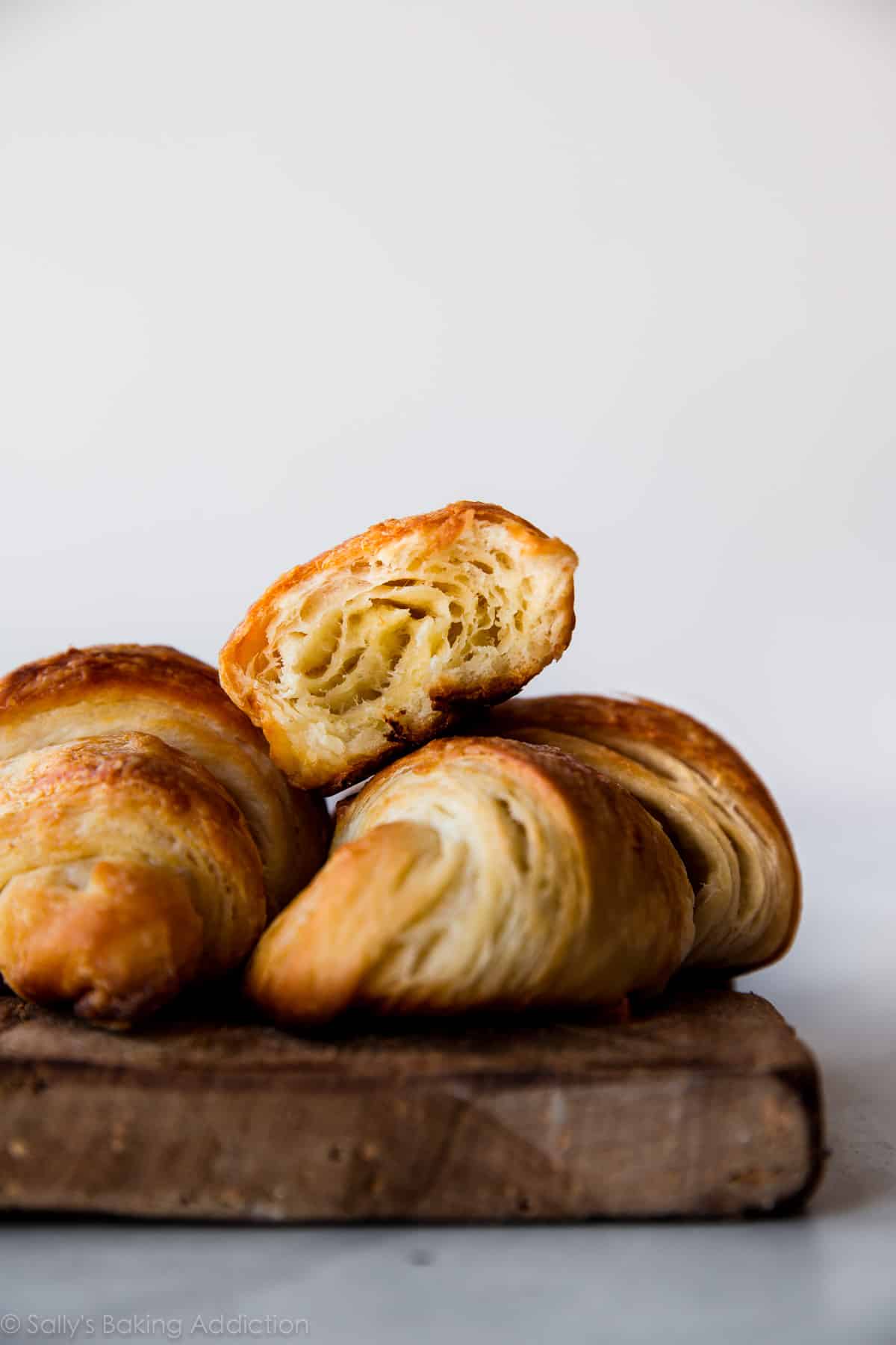 croissants on a wood serving tray