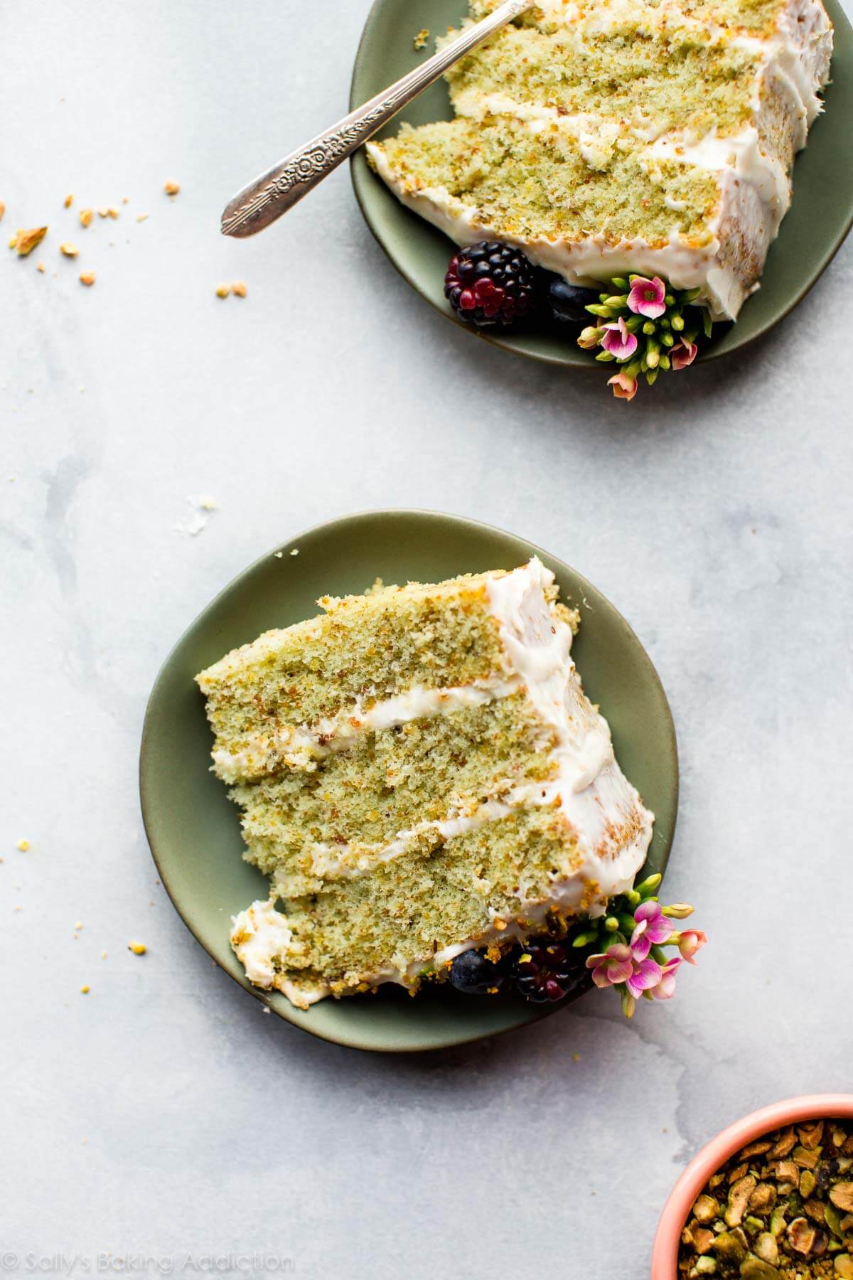 slices of pistachio cake on green plates