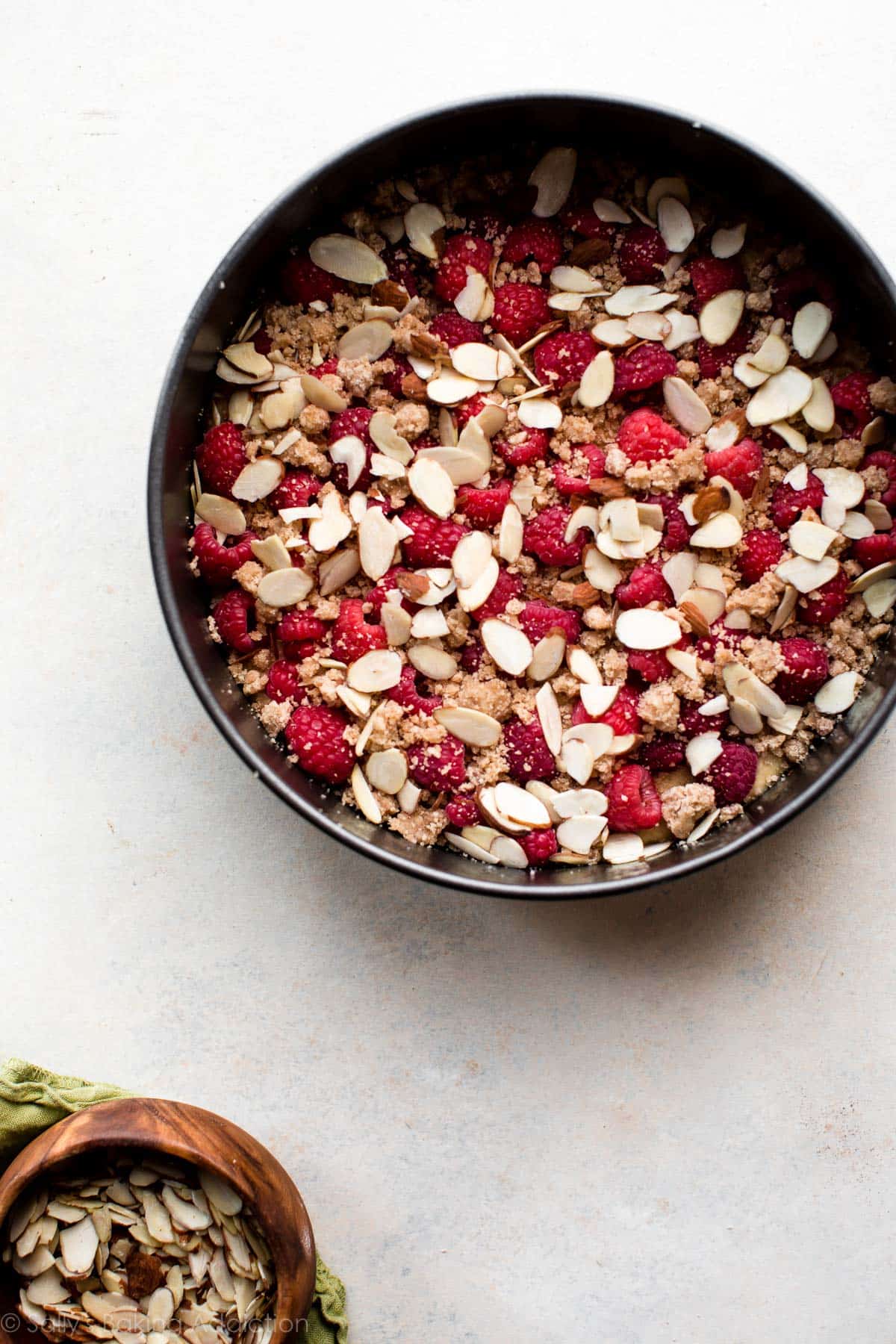 raspberry almond crumb cake in a springform pan before baking