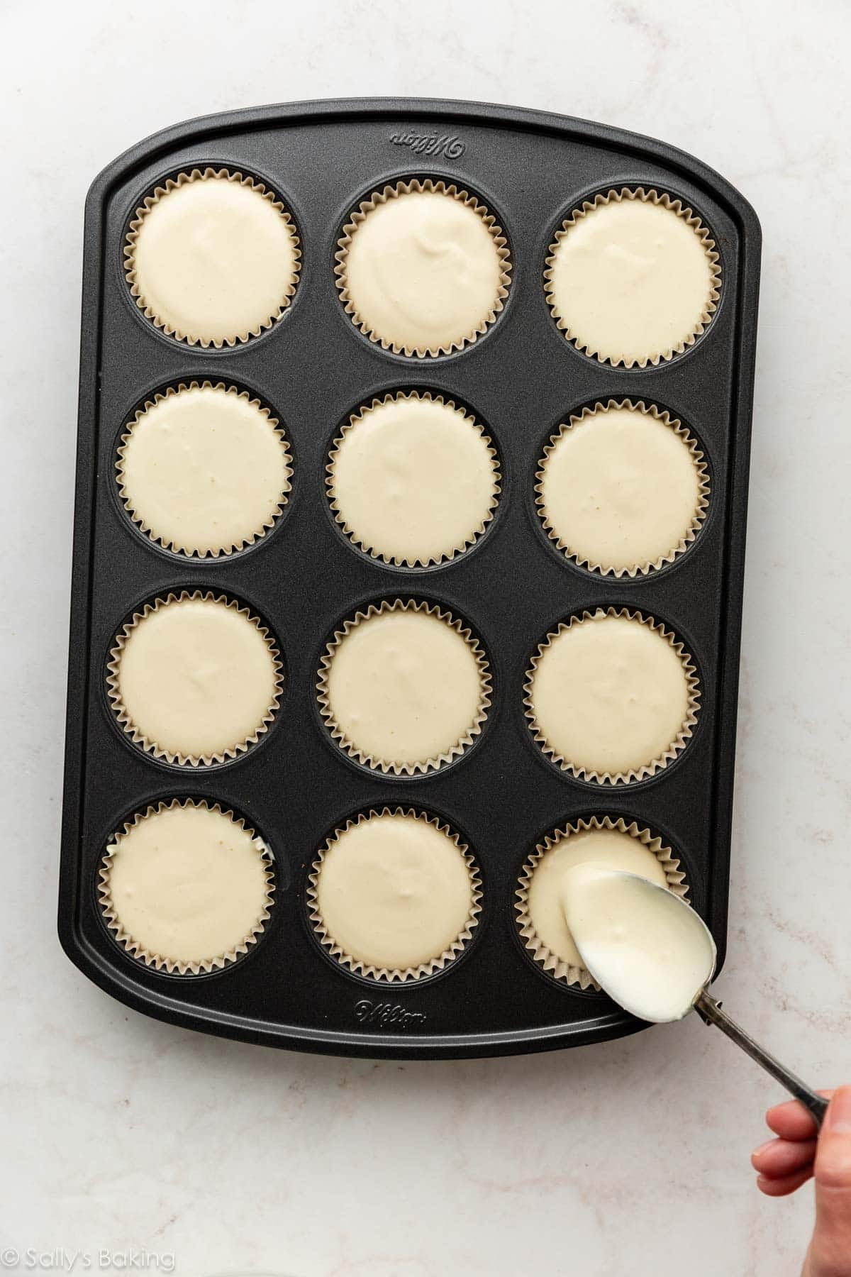 muffin pan with batter in it.