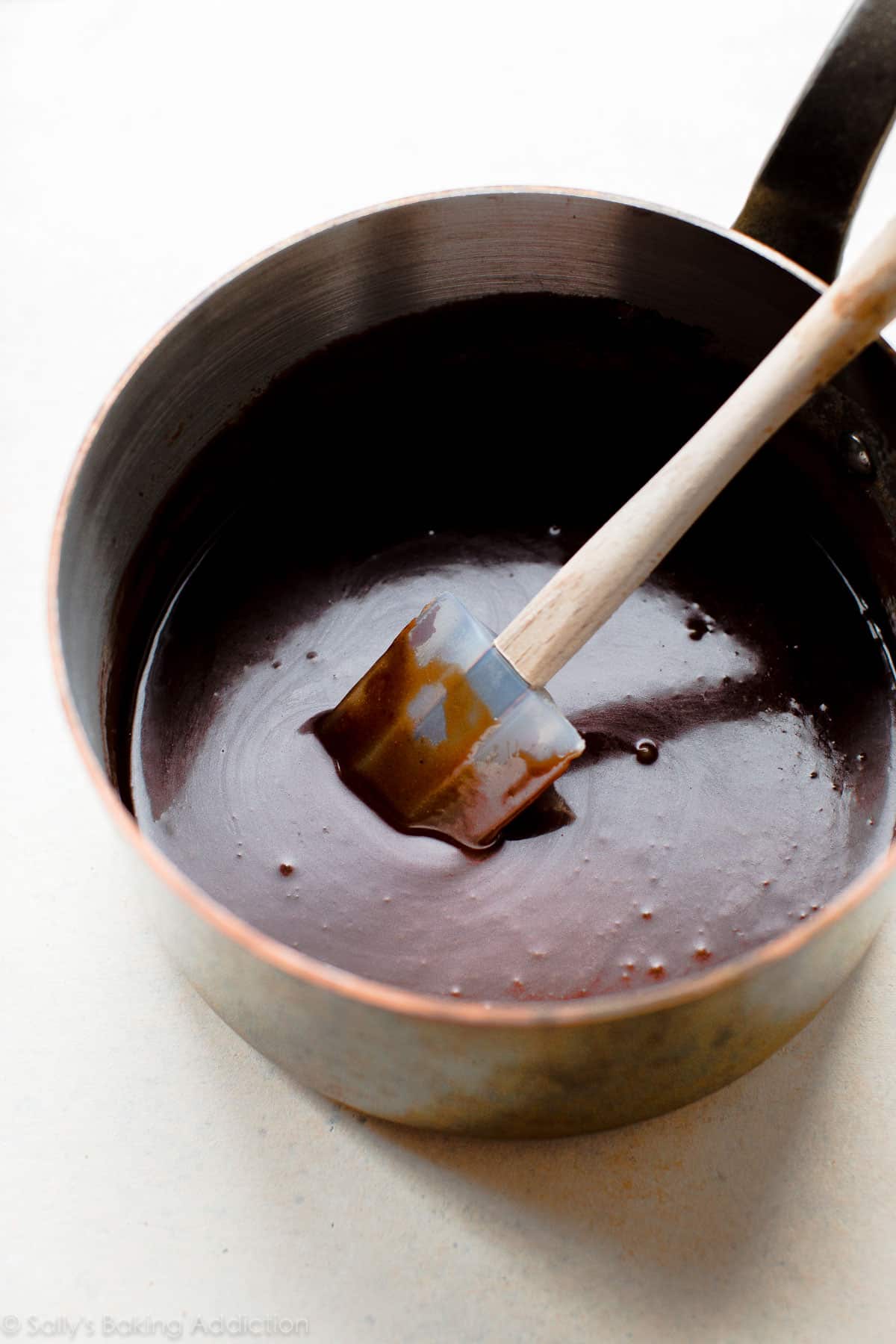 Chocolate fudge icing in a saucepan