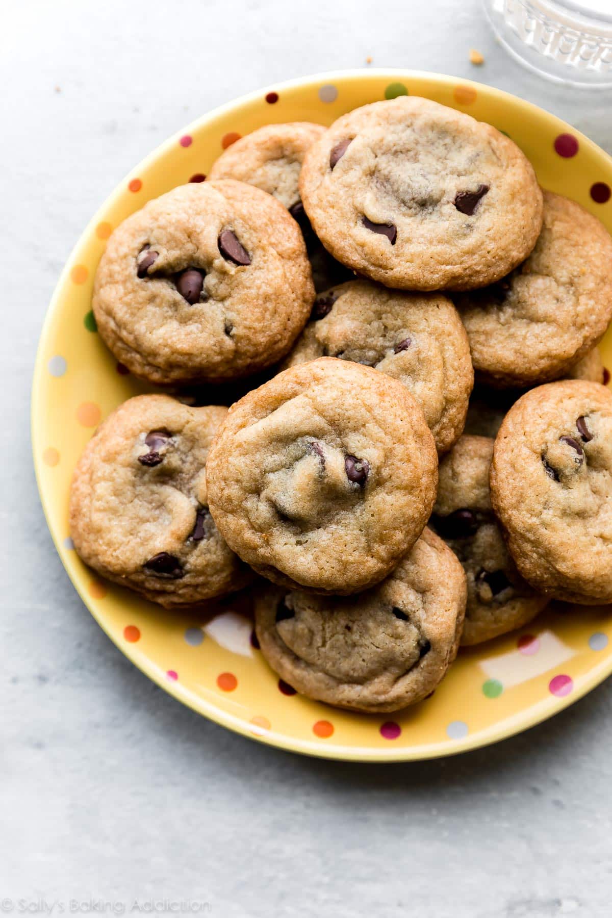 crispy chocolate chip cookies on a yellow polka dot plate