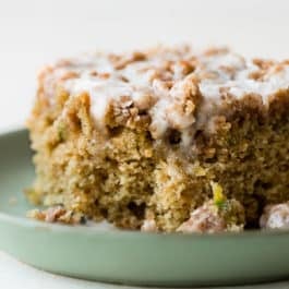 piece of zucchini crumb cake on a green plate