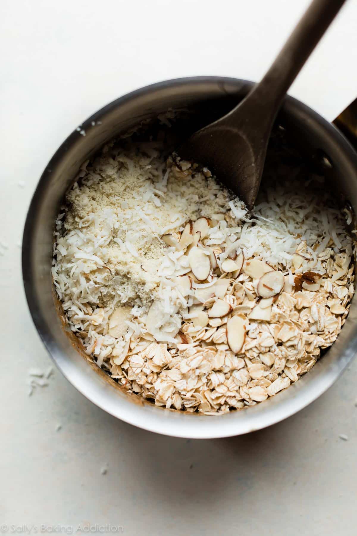 ingredients for coconut granola bars in a saucepan