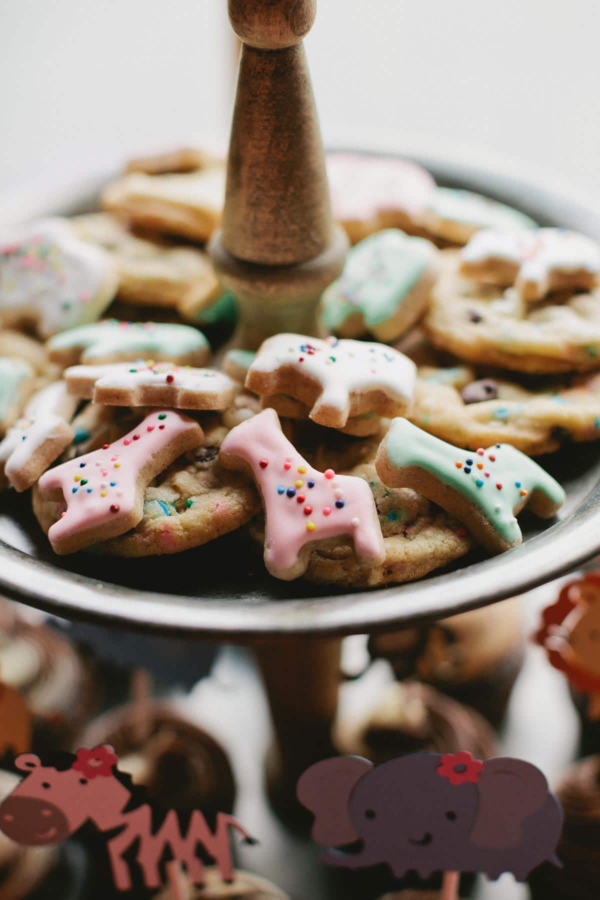 animal cracker cookies on dessert stand for 1st birthday party