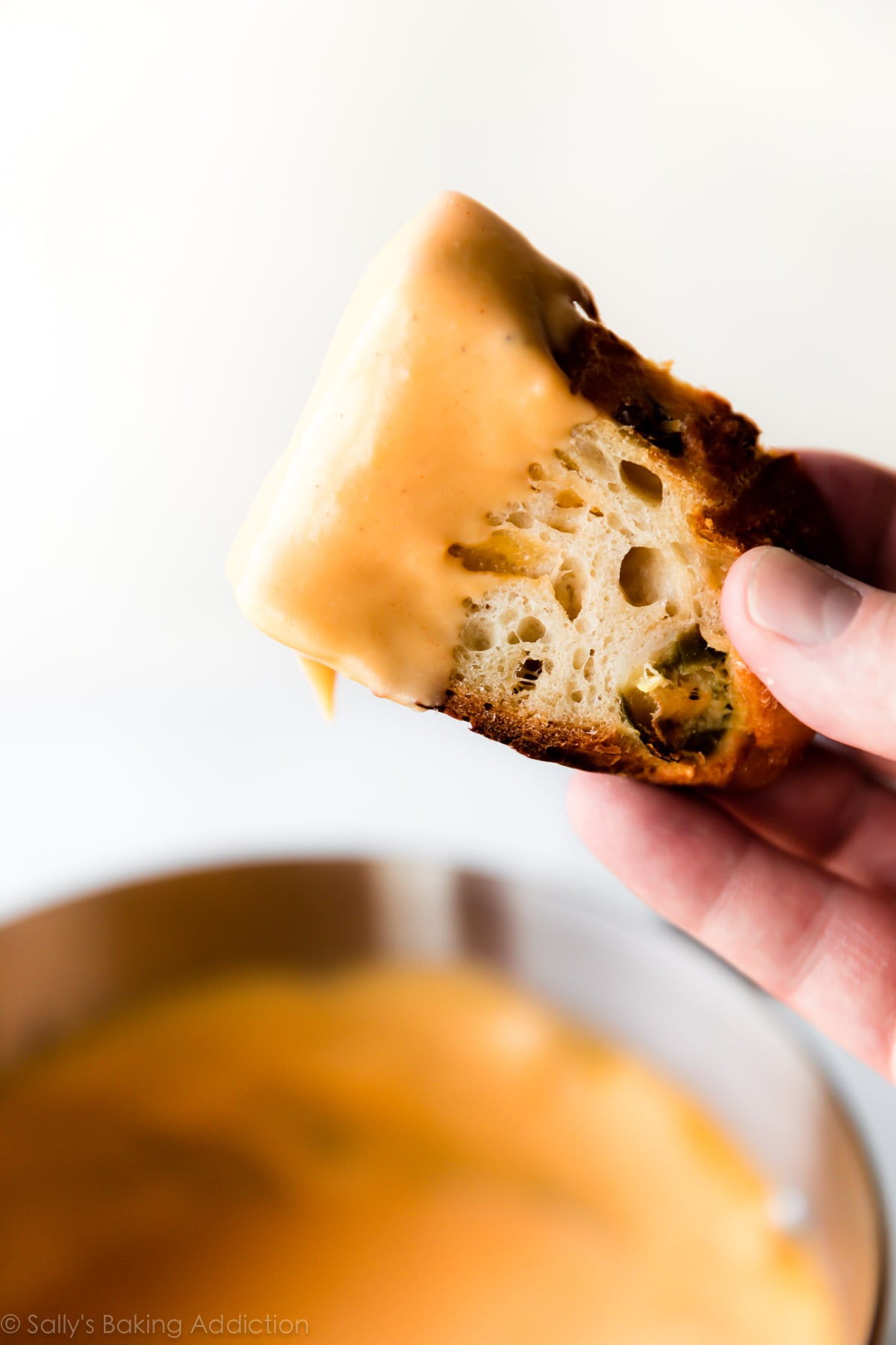 Crusty jalapeño cheddar bread with homemade spicy nacho cheese sauce