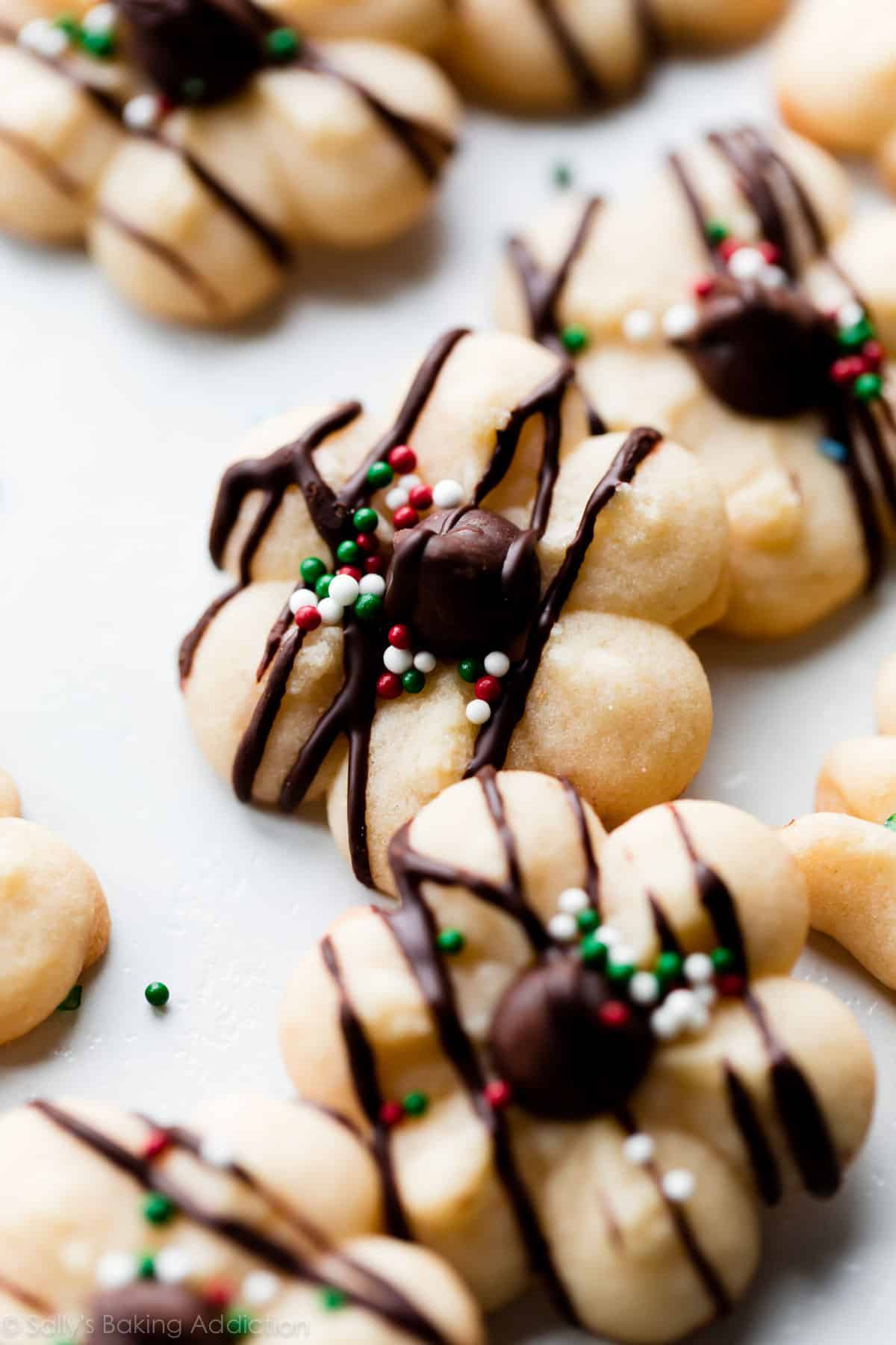 butter spritz cookies with chocolate chips and chocolate drizzle