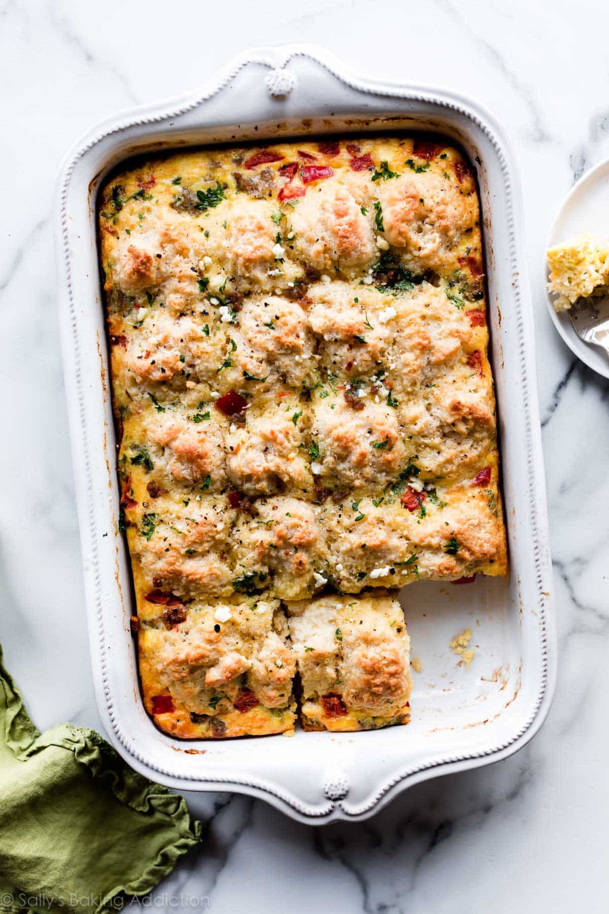 Biscuit breakfast casserole in a white casserole dish