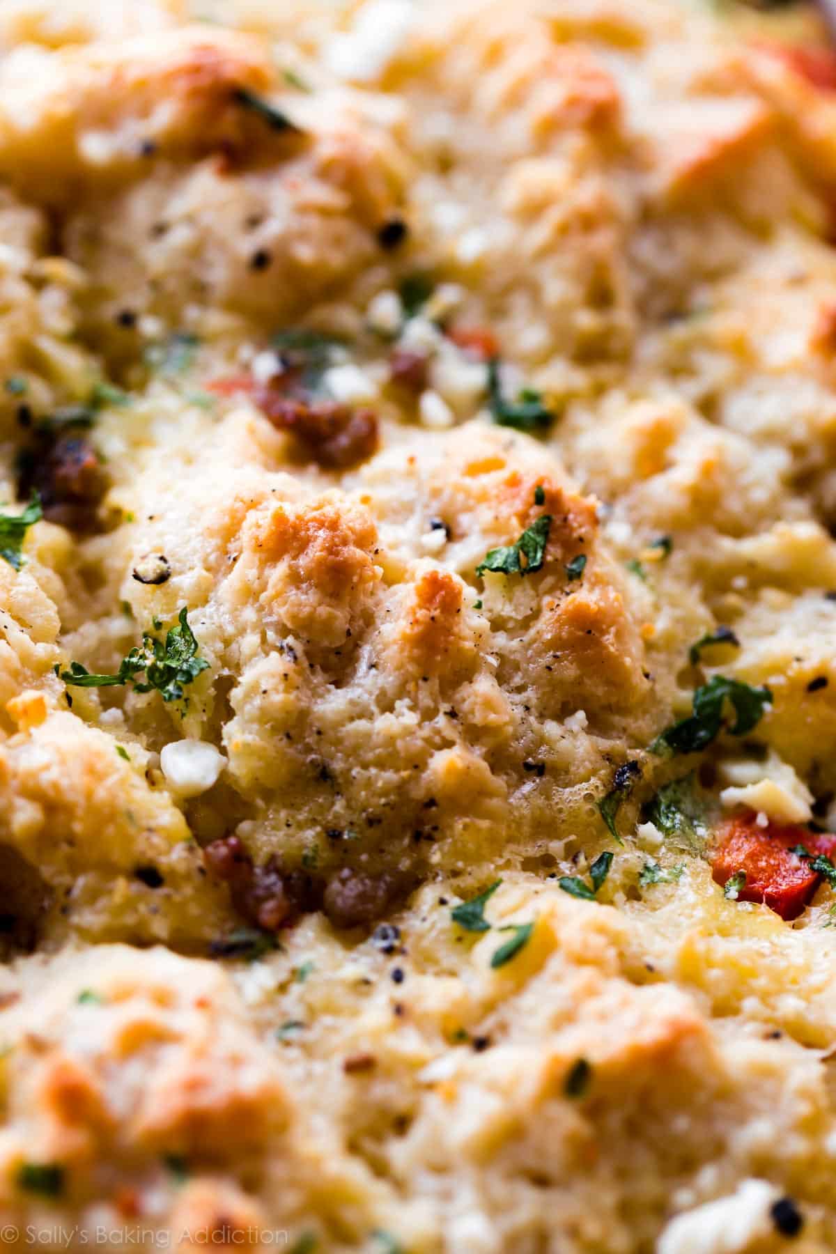 zoomed in image of biscuits on top of breakfast egg and sausage casserole