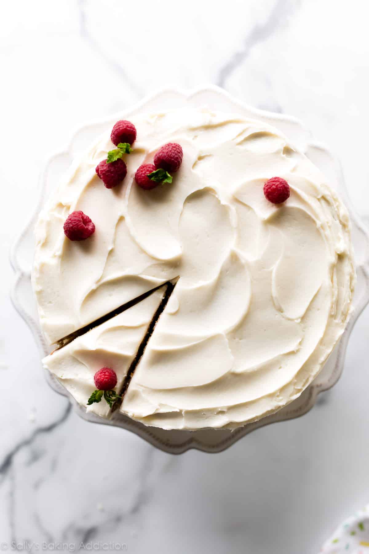 Top of a vanilla cake with raspberries