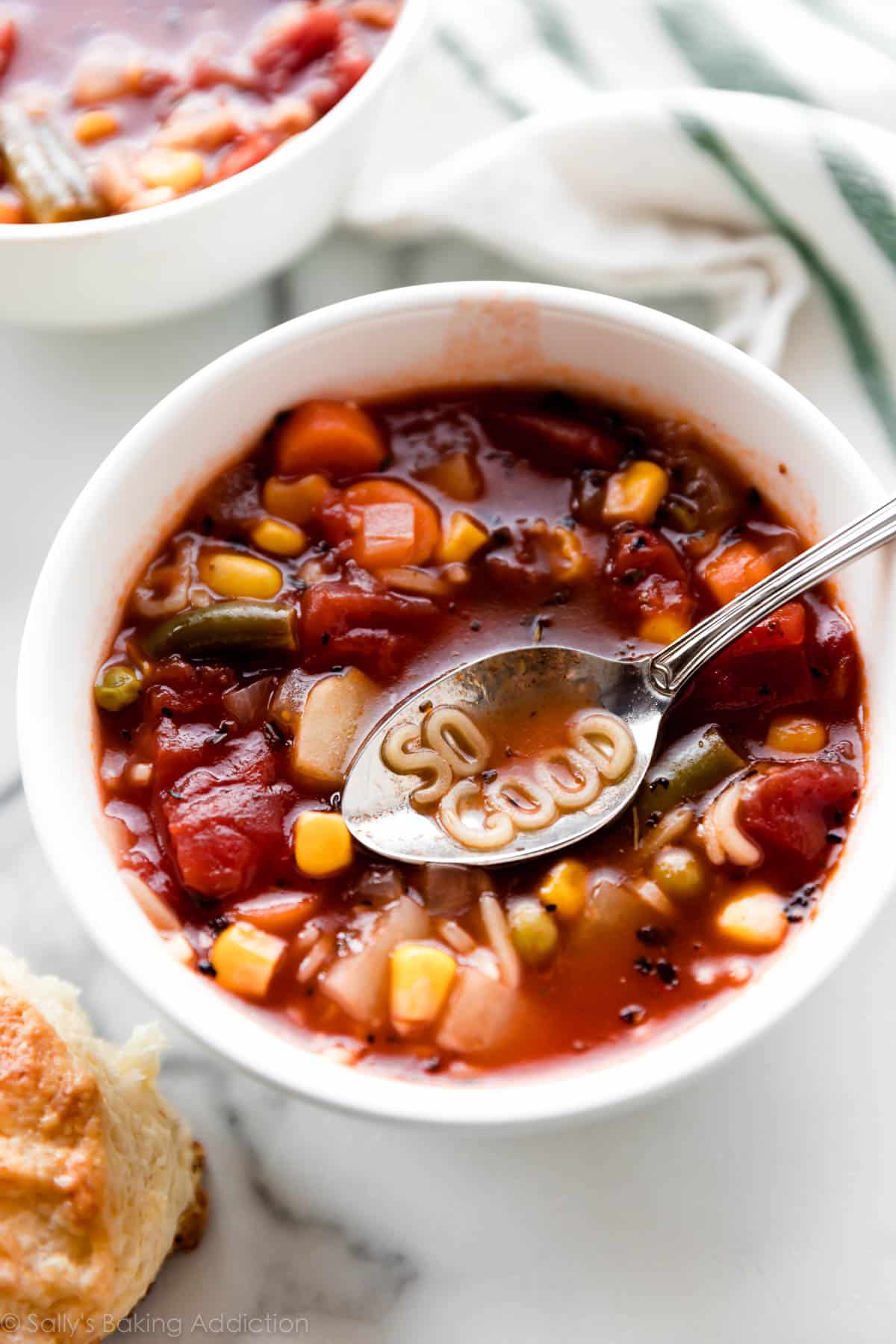 Homemade alphabet vegetable soup in a white bowl