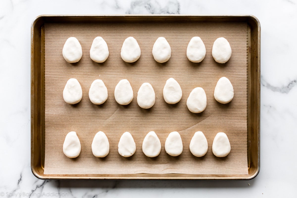 Egg shaped candy on baking sheet