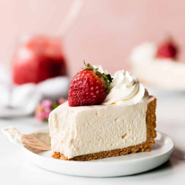 Slice of no bake cheesecake on white plate