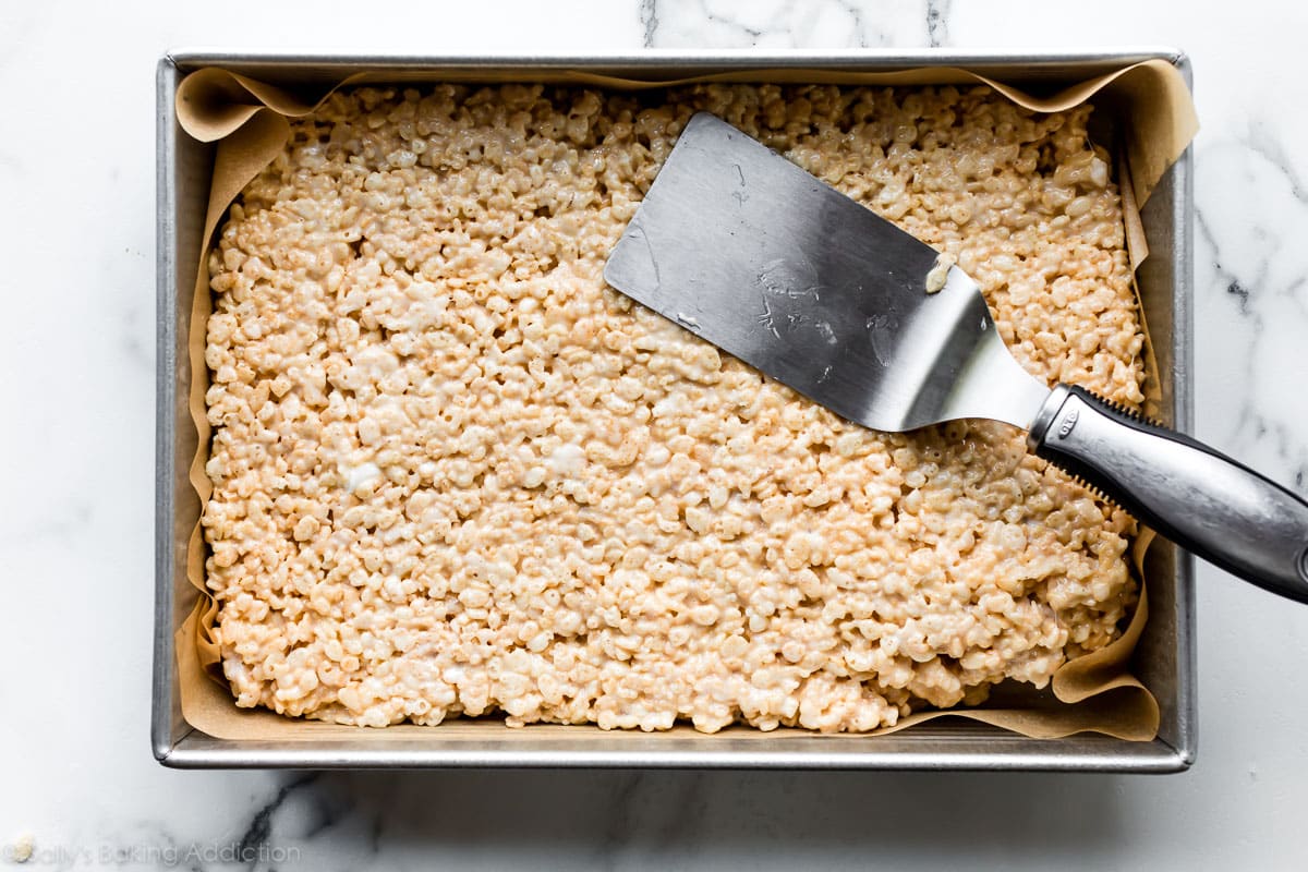 Pan of rice krispie treats with spatula