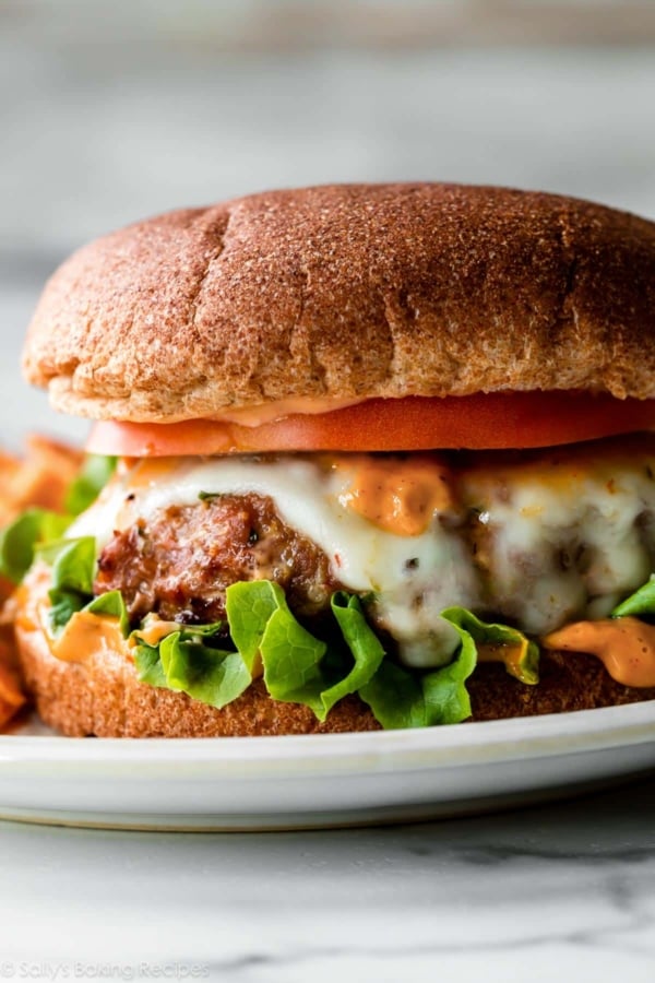 spicy turkey burger on whole wheat bun with lettuce and pepper jack cheese.