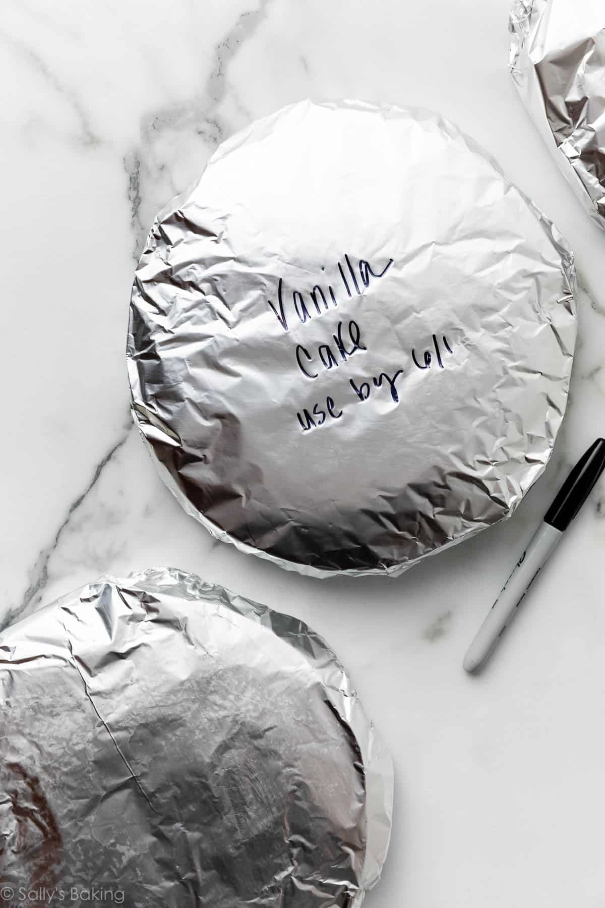 aluminum foil-wrapped cake layers.