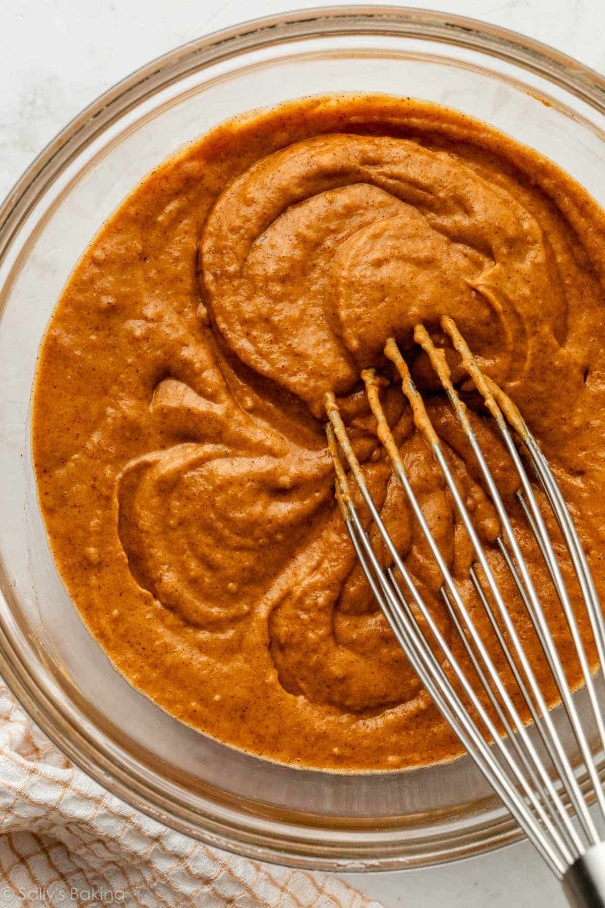 batter in glass bowl with whisk.