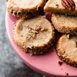 pecan shortbread cookies on a pink cake stand