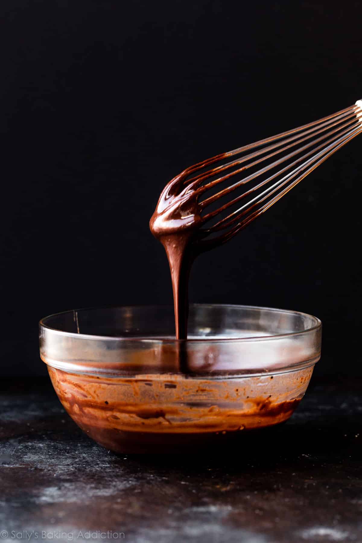 chocolate pie filling dropping off of a whisk