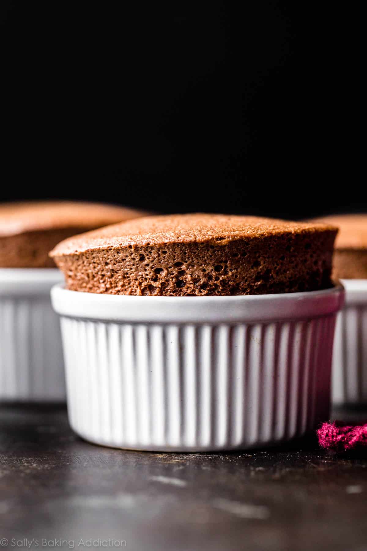 chocolate soufflé in white ramekin