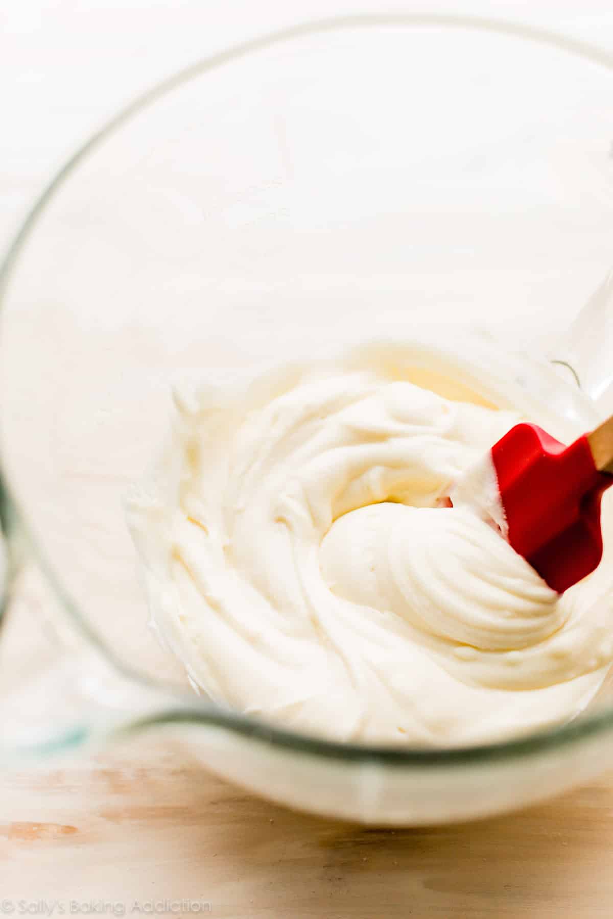 cream cheese frosting in glass bowl