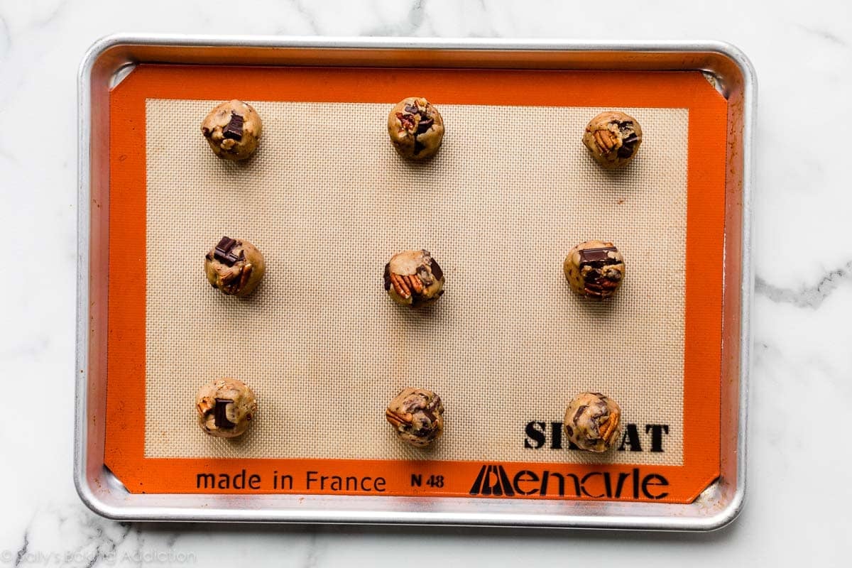 cookie dough balls on baking sheet