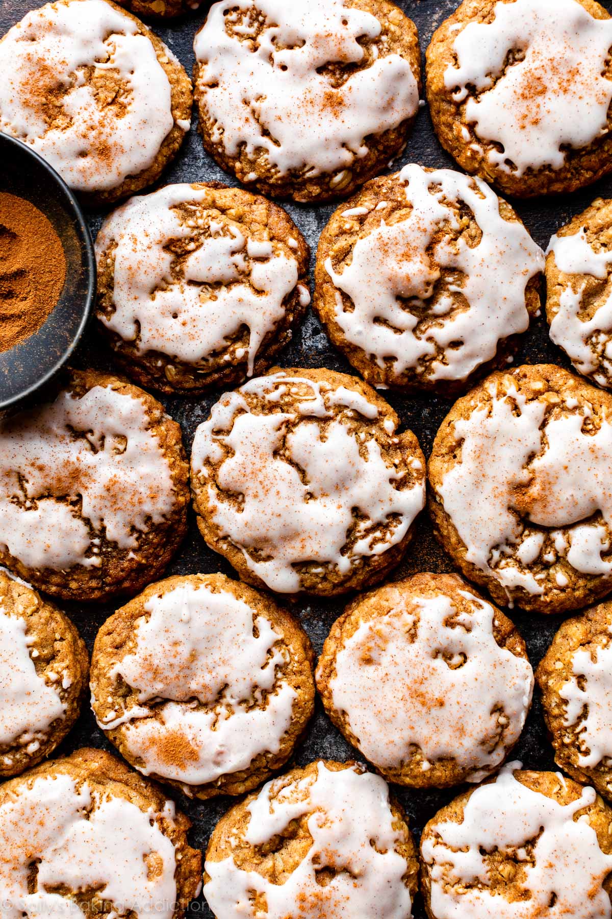 gingerbread oatmeal cookies with icing and cinnamon on top