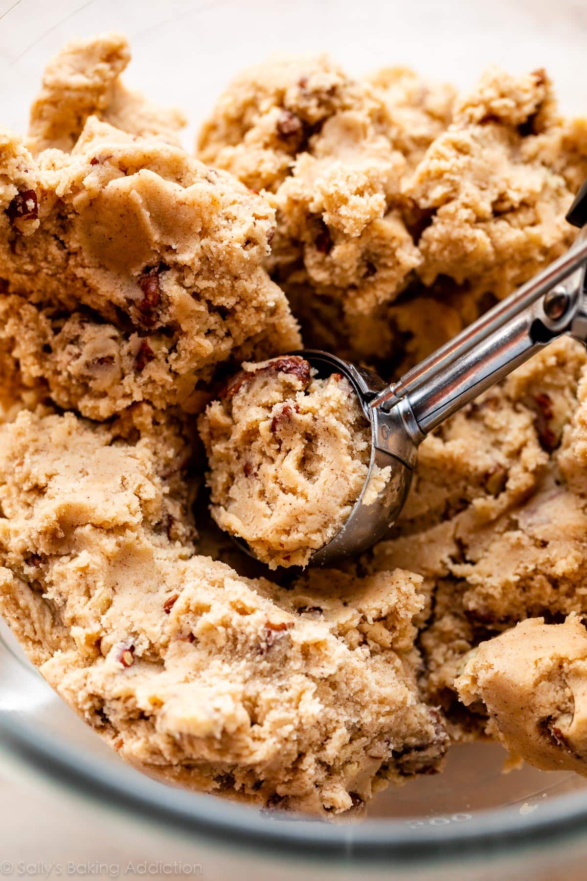 cookie scoop scooping up maple pecan snickerdoodle cookie dough