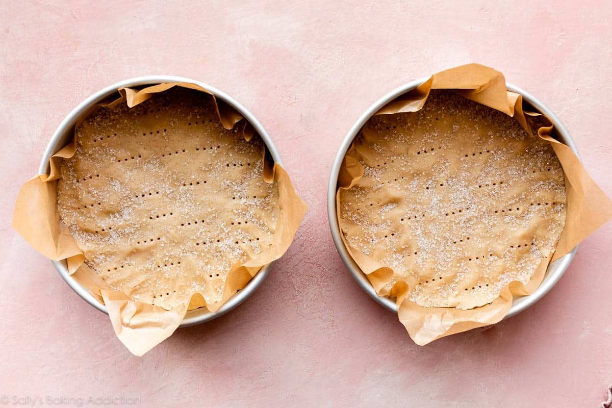 shortbread dough pressed into round cake pans and topped with coarse sugar
