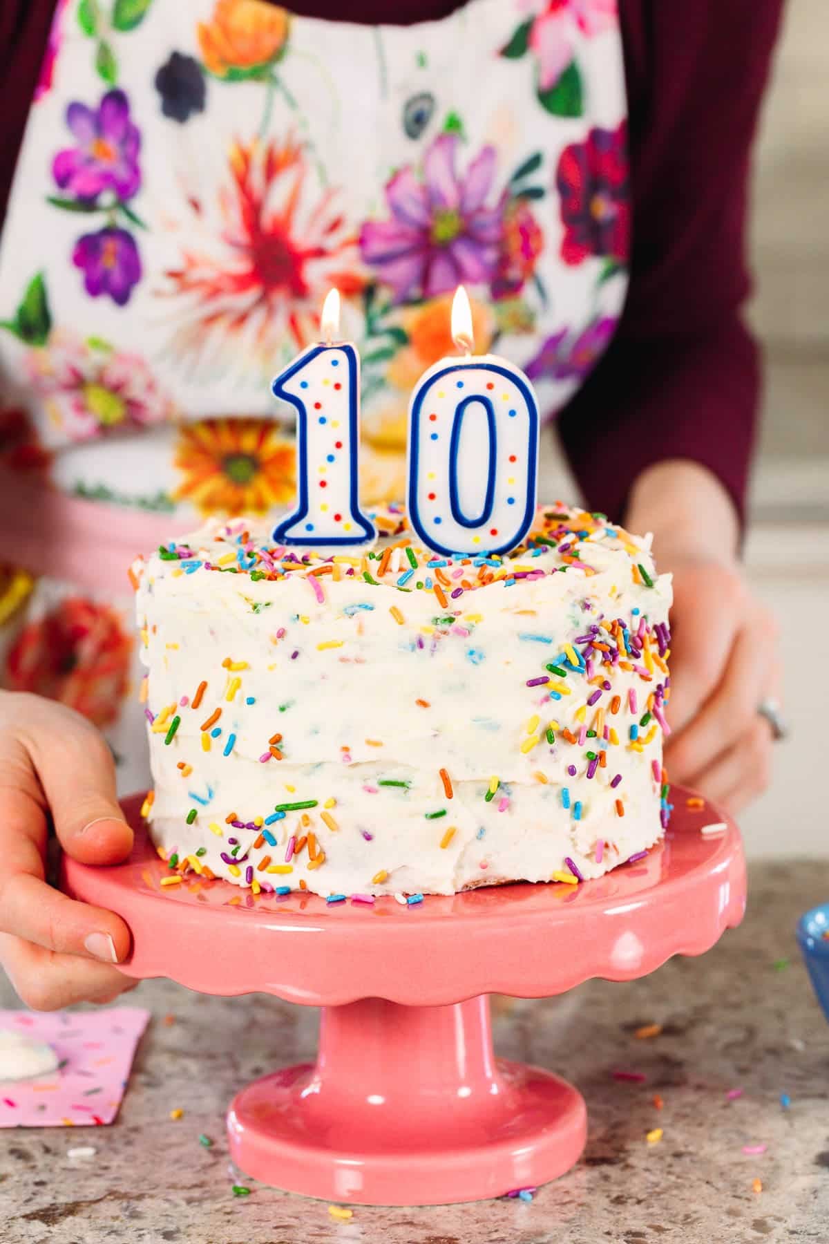 6 inch vanilla frosted cake with sprinkles and number 10 candles