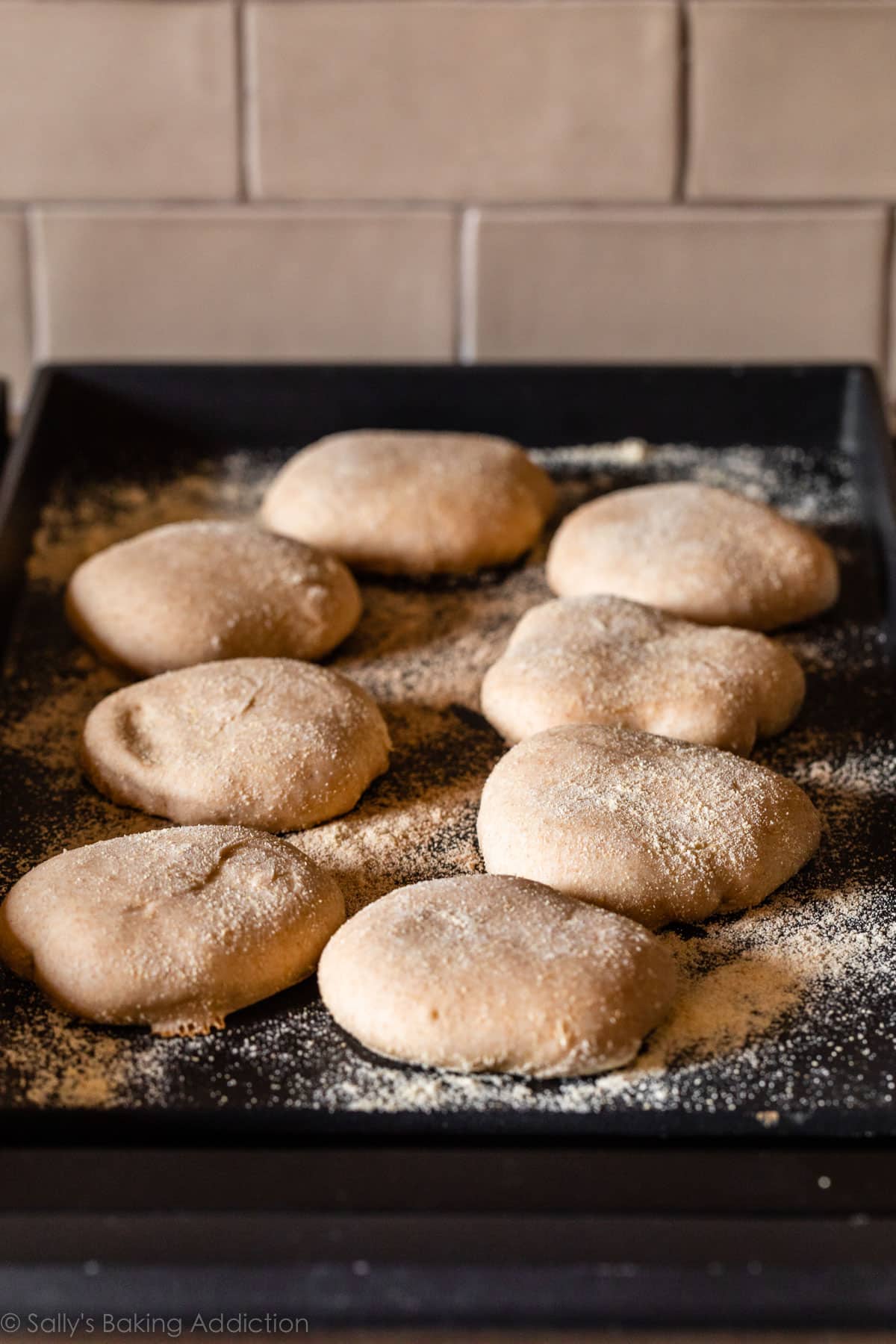 cooking English muffins on the griddle on the stove