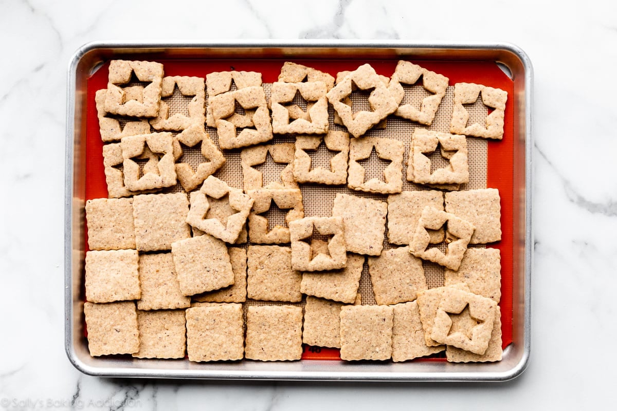 tops and bottoms of hazelnut linzer-style cookie sandwiches