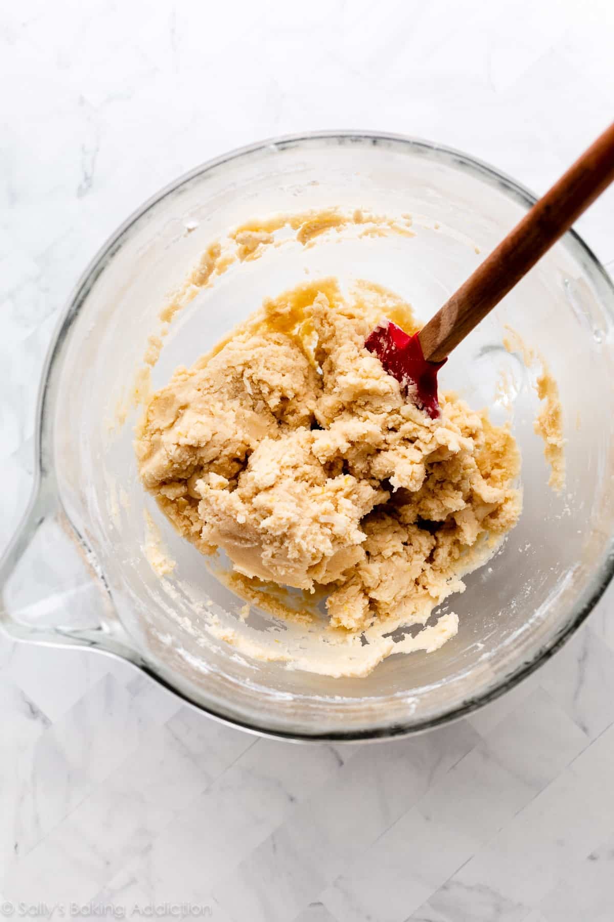 lemon coconut shortbread dough in glass bowl