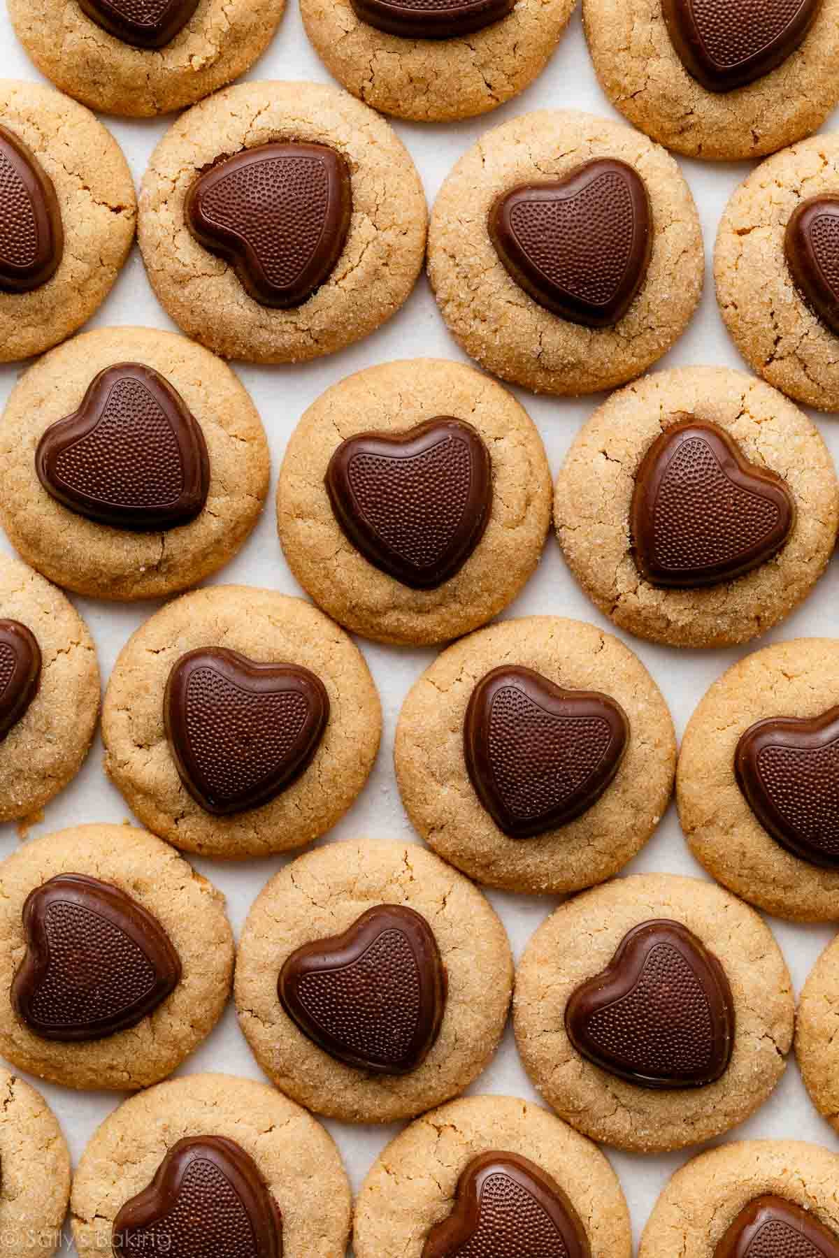 peanut butter Valentine's Day cookies with a chocolate heart on top.