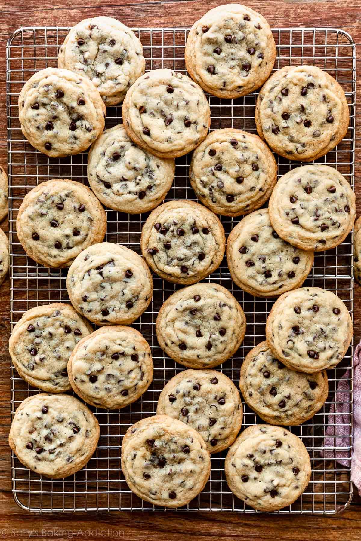 chocolate chip cookies with mini chocolate chips on wire cooling rack.