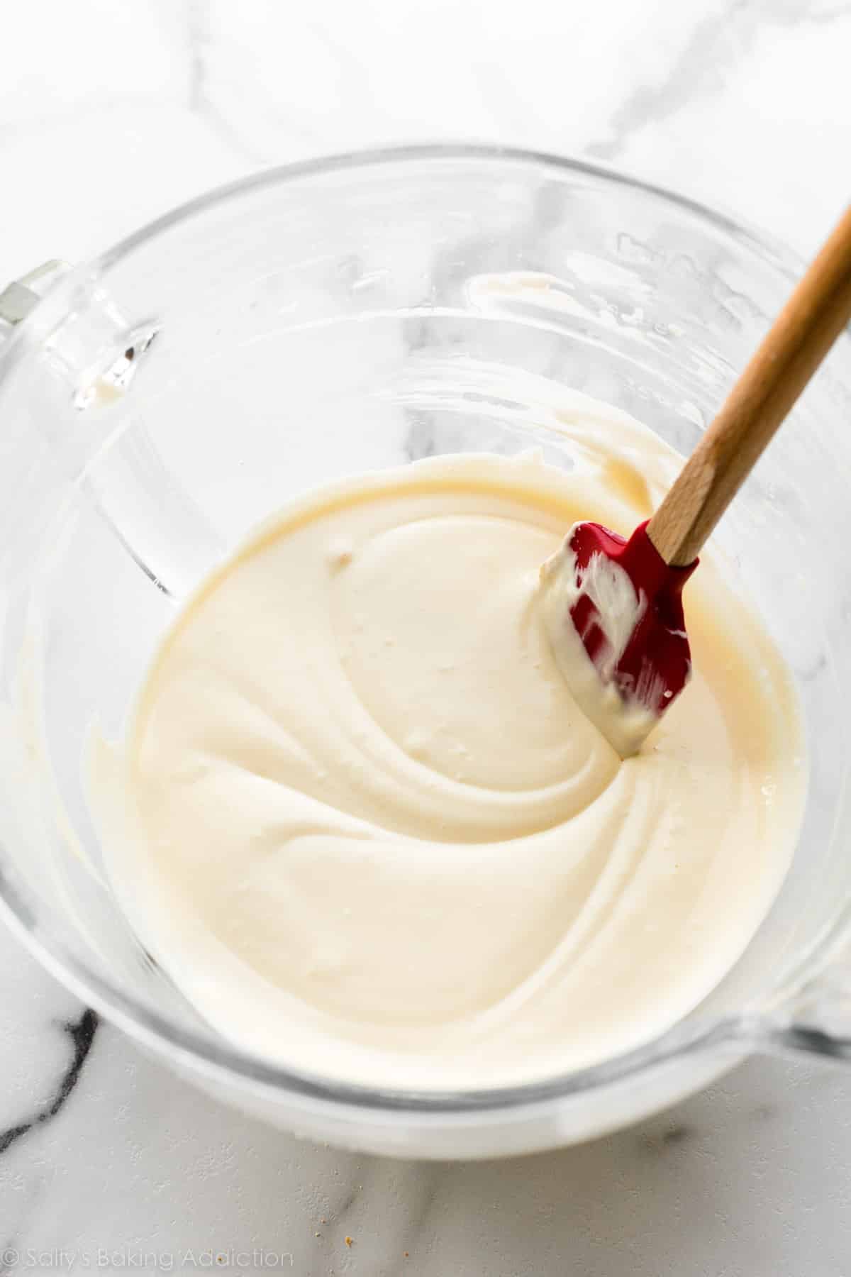 filling batter in glass mixing bowl.