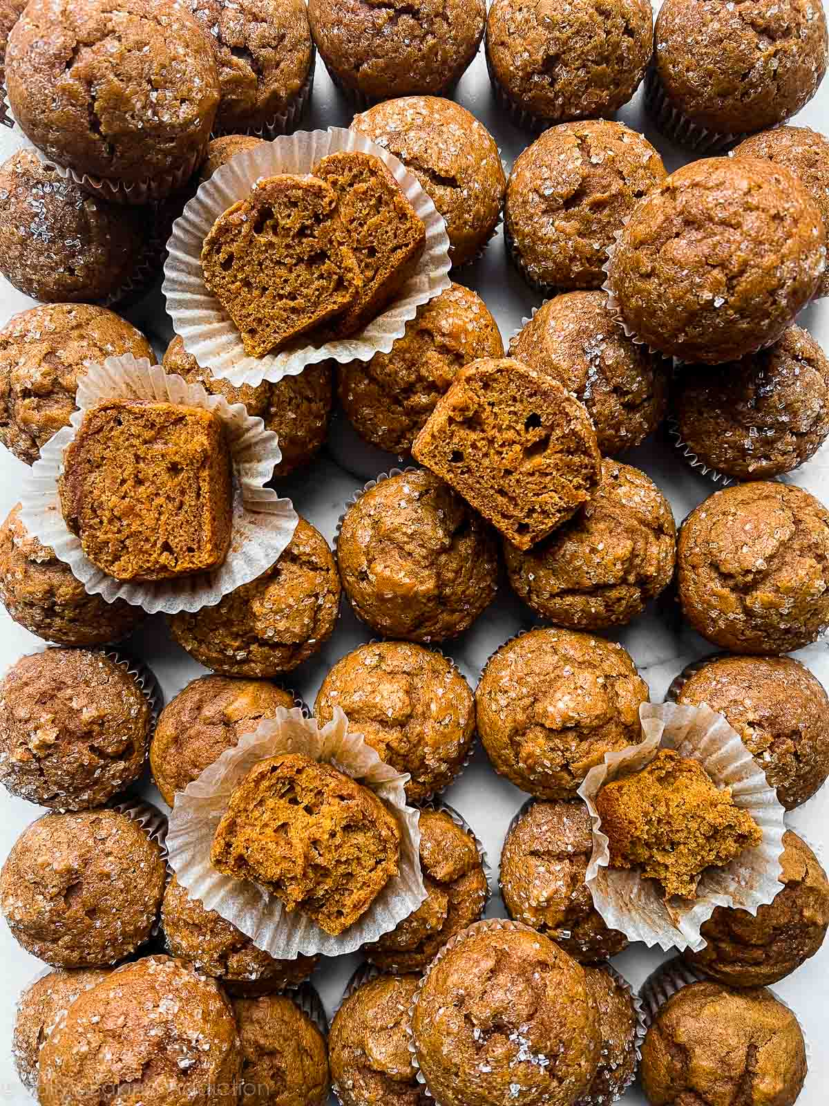 overhead photo of 30+ pumpkin muffins.