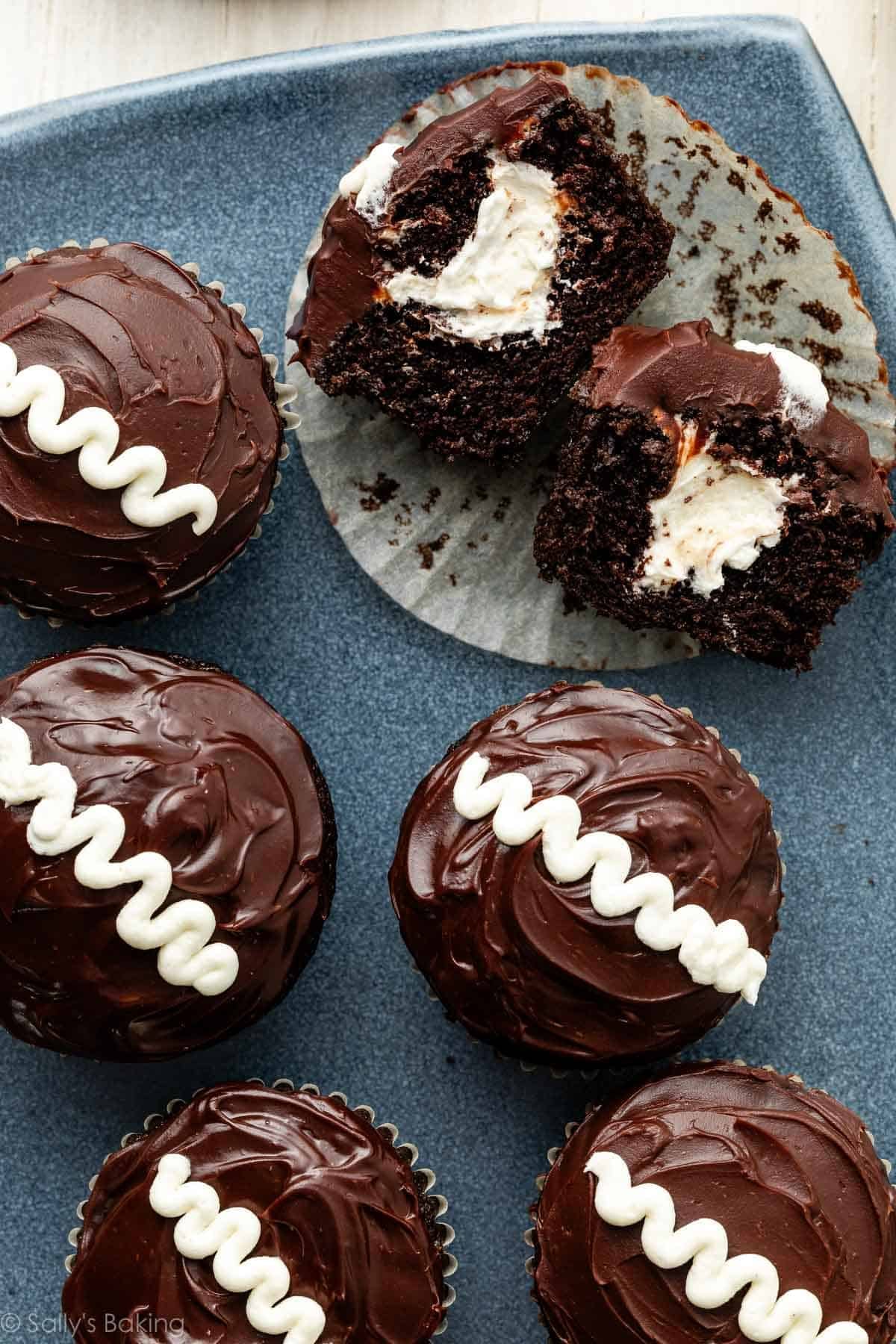 cream-filled chocolate cupcakes on blue platter.