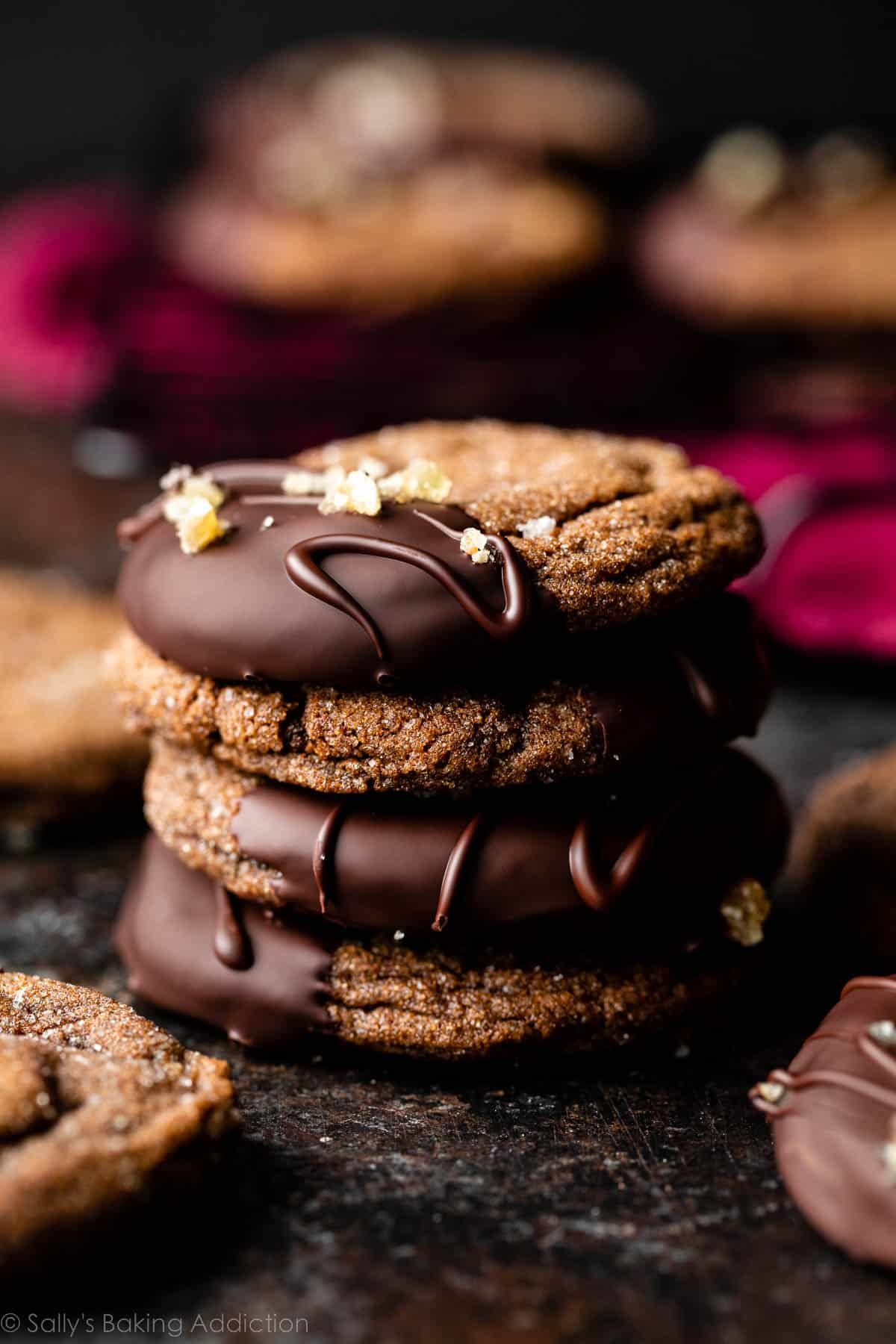stack of 4 chocolate ginger cookies dipped in chocolate.