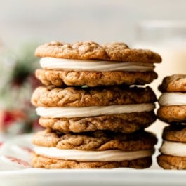 stack of 3 eggnog oatmeal cream pie cookies.