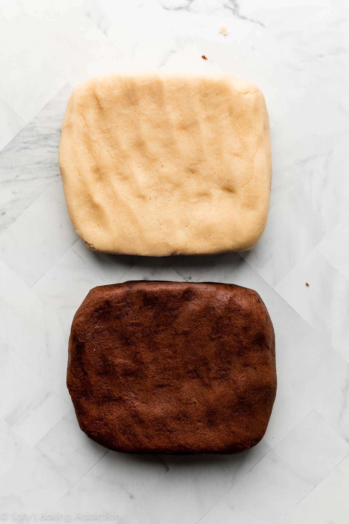 two blocks of dough, one vanilla and one chocolate.