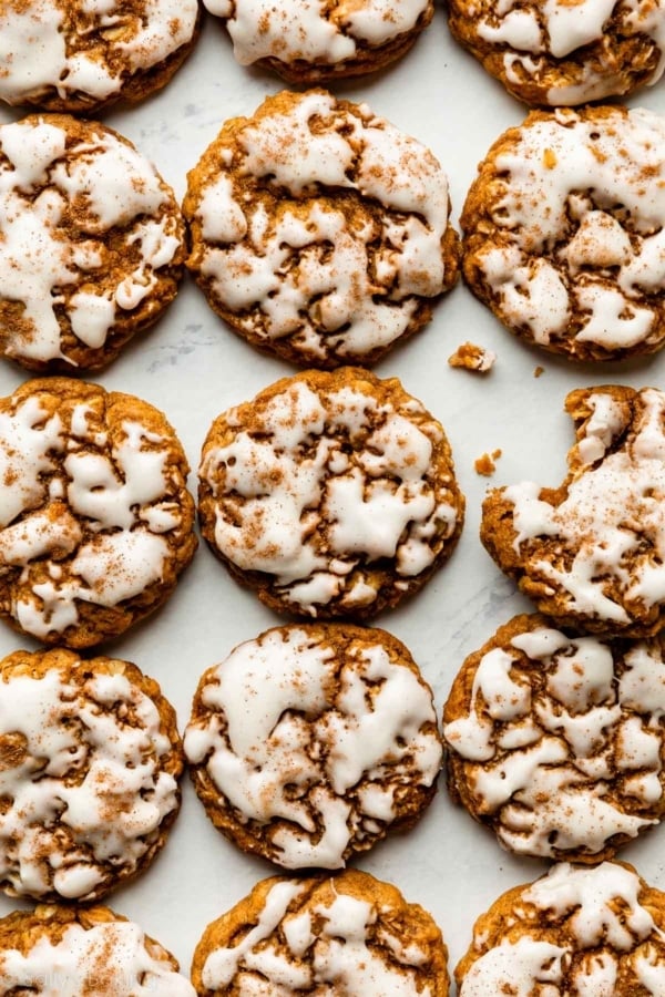 pumpkin oatmeal cookies with brown butter icing on top.