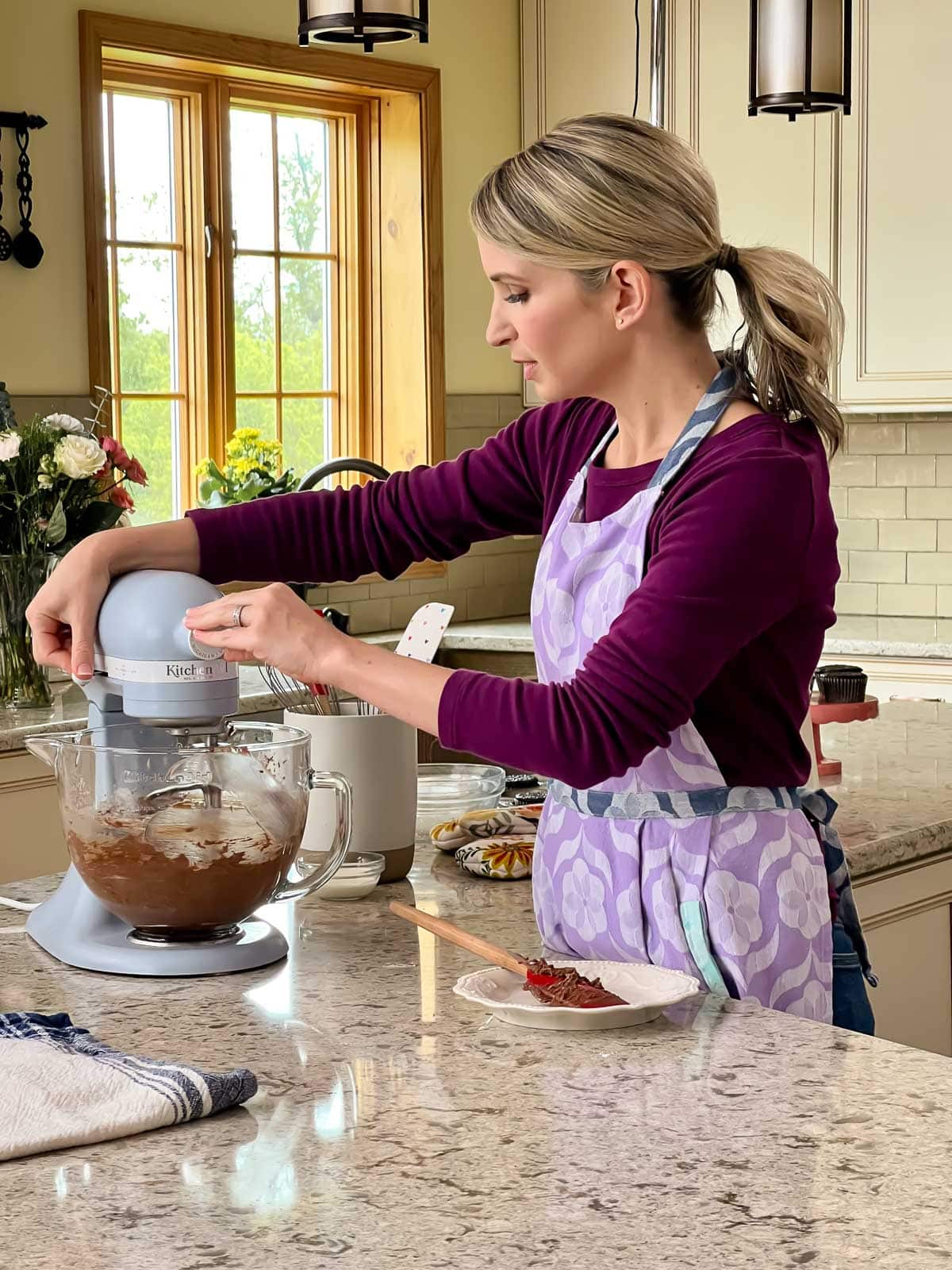 Sally with blue mixer making frosting.