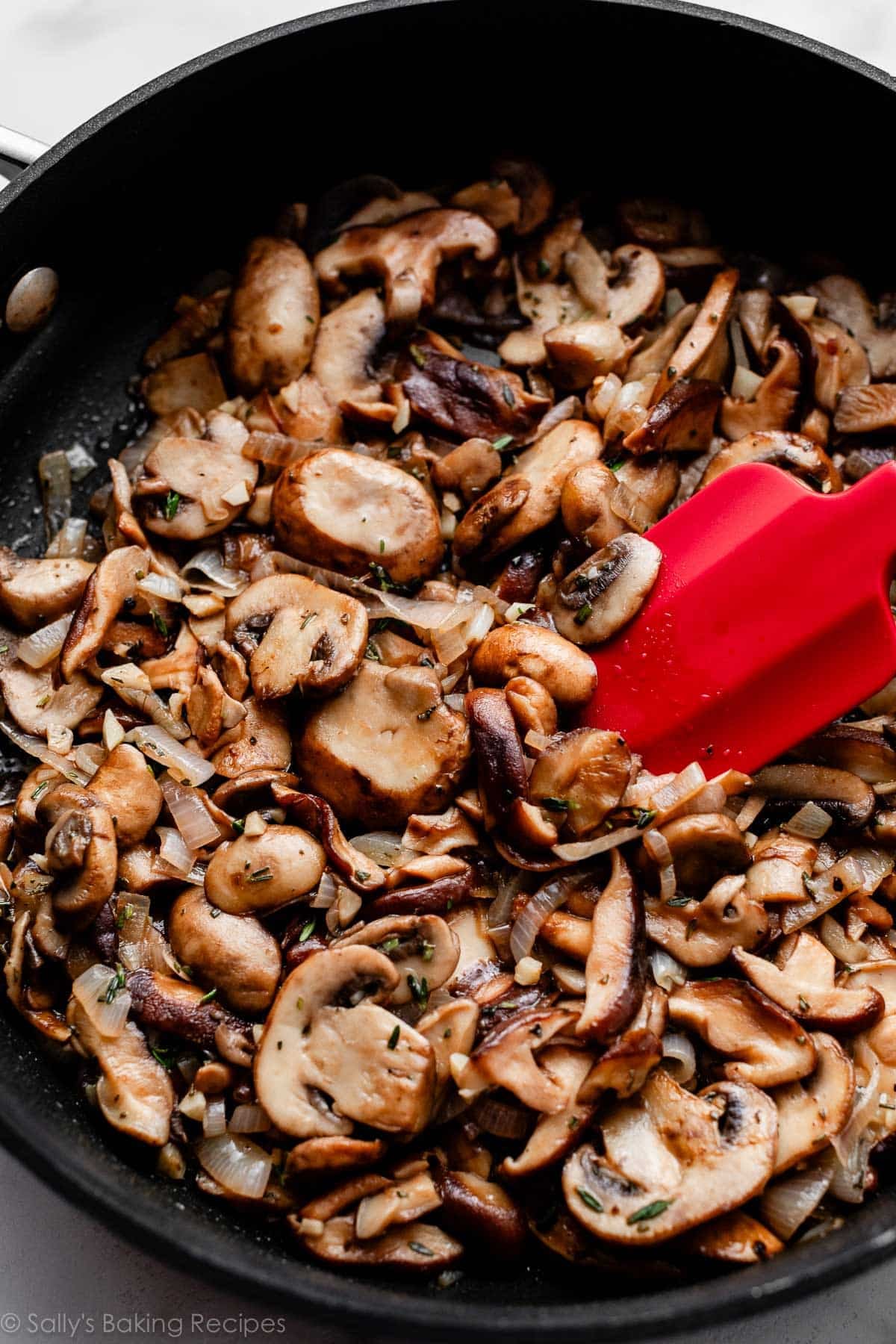 sauteed mushrooms and shallots in skillet.