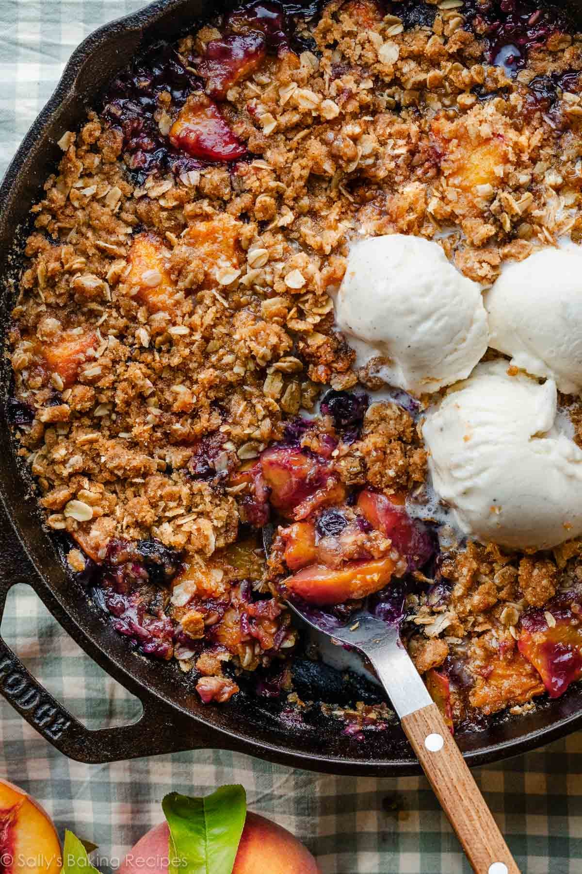 brown butter blueberry peach crisp in cast iron skillet.