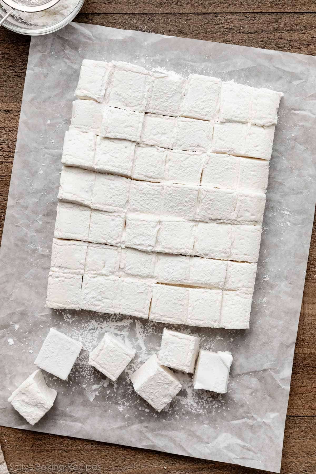 cut marshmallows on white parchment paper.